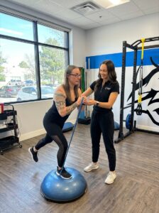 Patient working with a provider at a sports medicine clinic in Centennial, CO receiving specialized manual therapy treatment