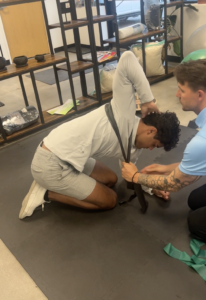 Patient receiving manual therapy and rehab on their back at a chiropractic and sports rehab clinic in Centennial, CO